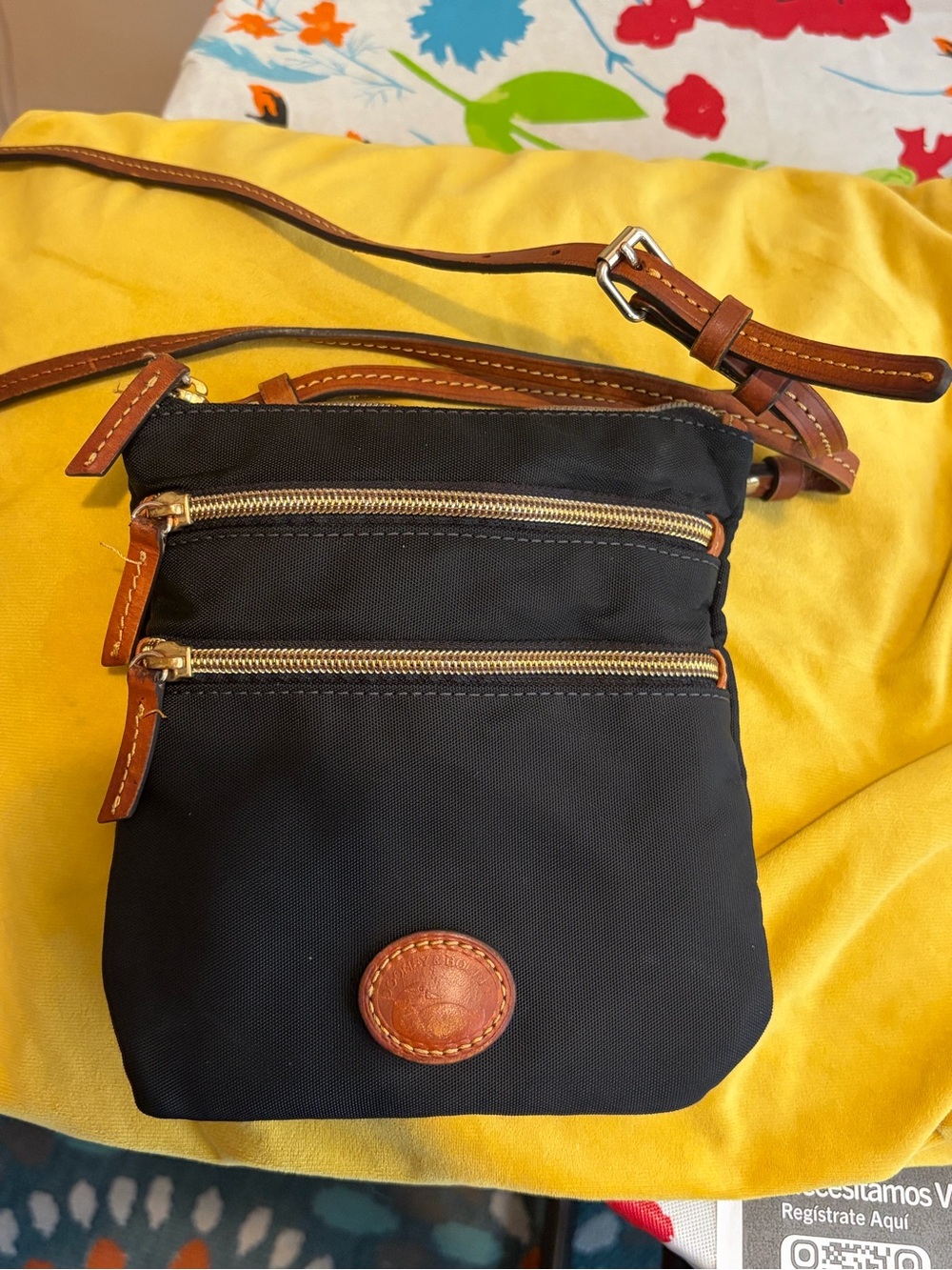 Dooney & Bourke Crossbody Bag with Brown Leather Trim and Dual Zip Pockets